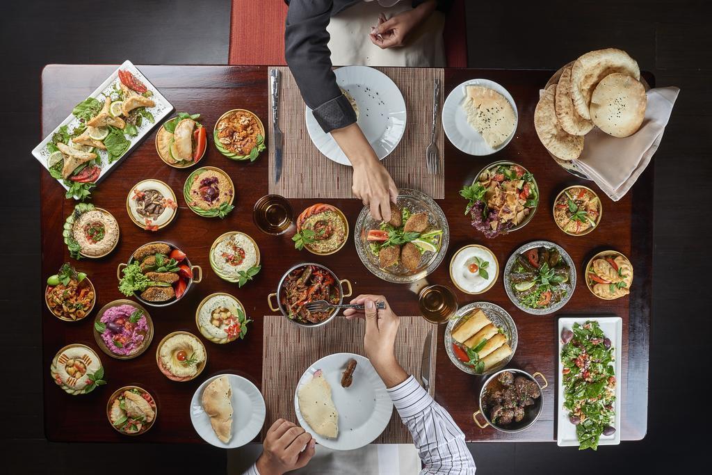Four Seasons Cairo At The First Residence Giza Екстер'єр фото A selection of dishes at a restaurant in Dubai